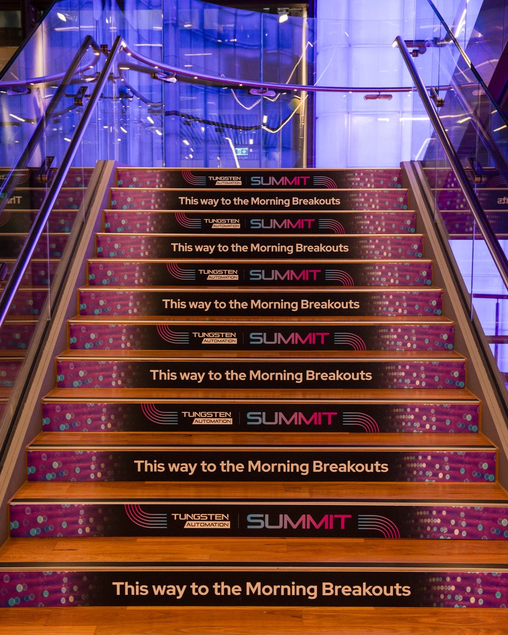 Branded stair risers guiding delegates at the Tungsten summit