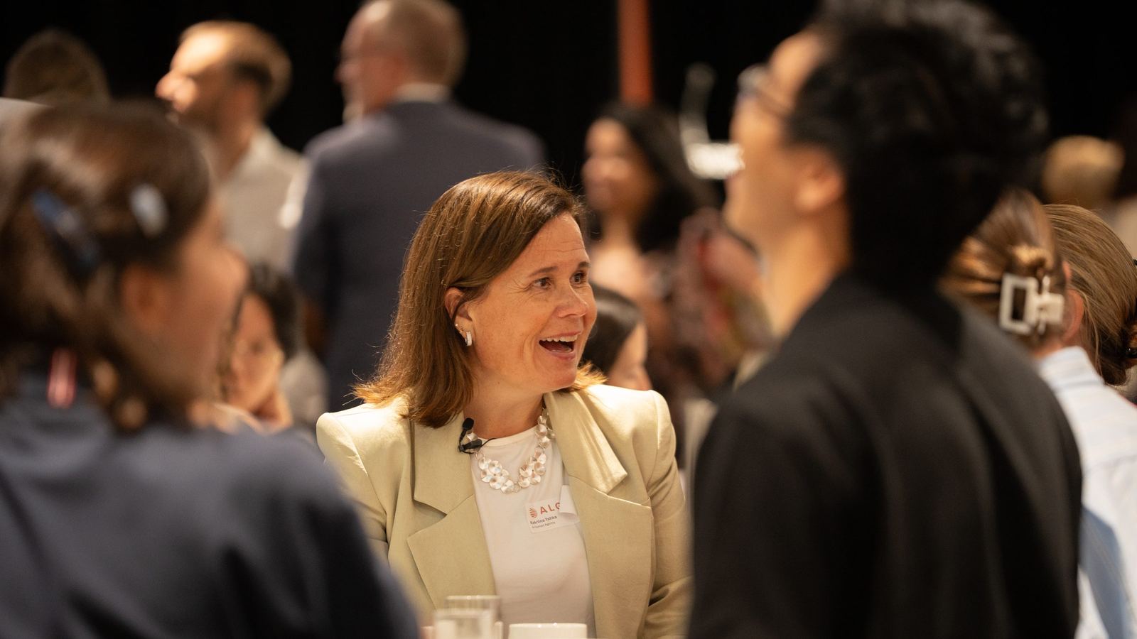 Guest laughing in conversation