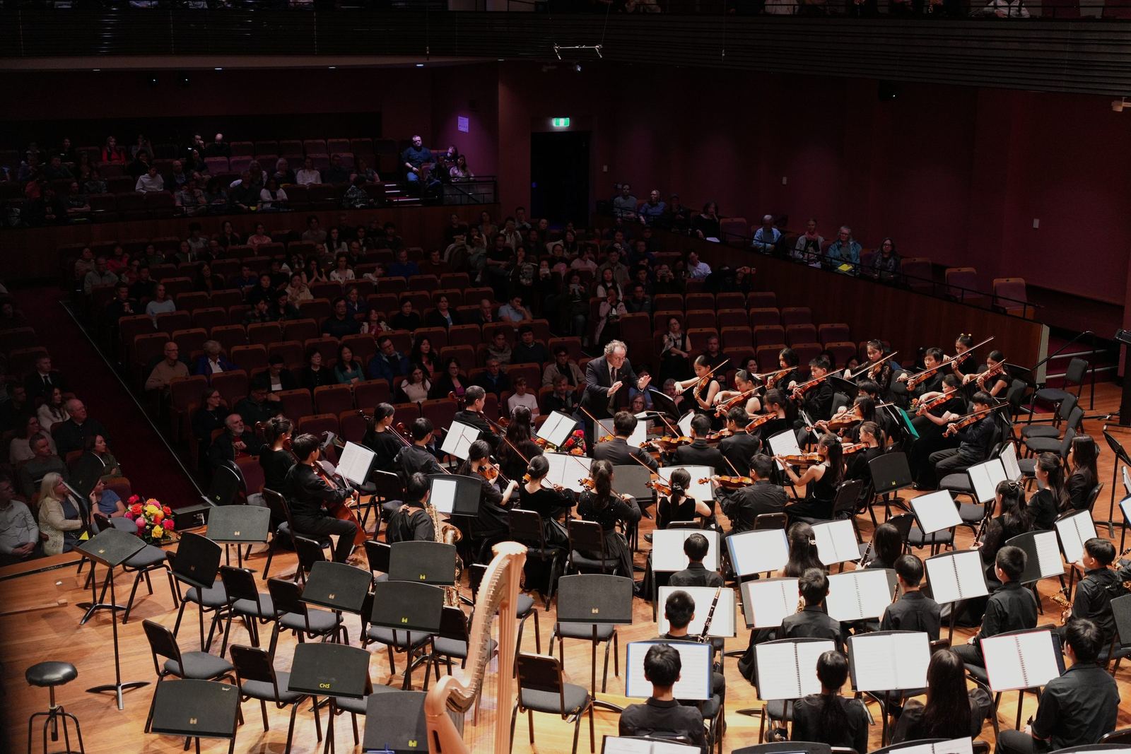 Full orchestra from the gallery with the audience around them