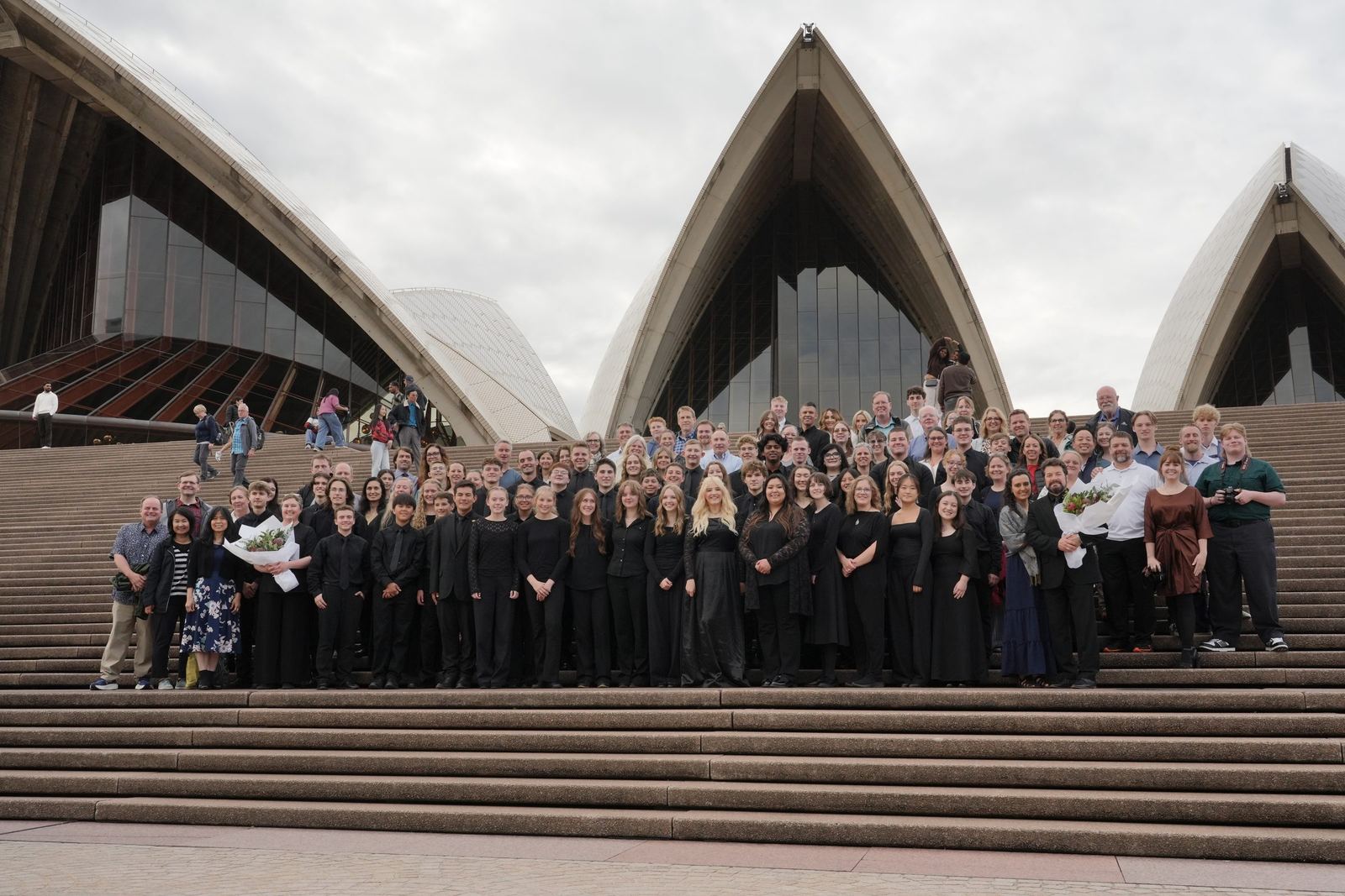 The full group with families on the Opera House steps